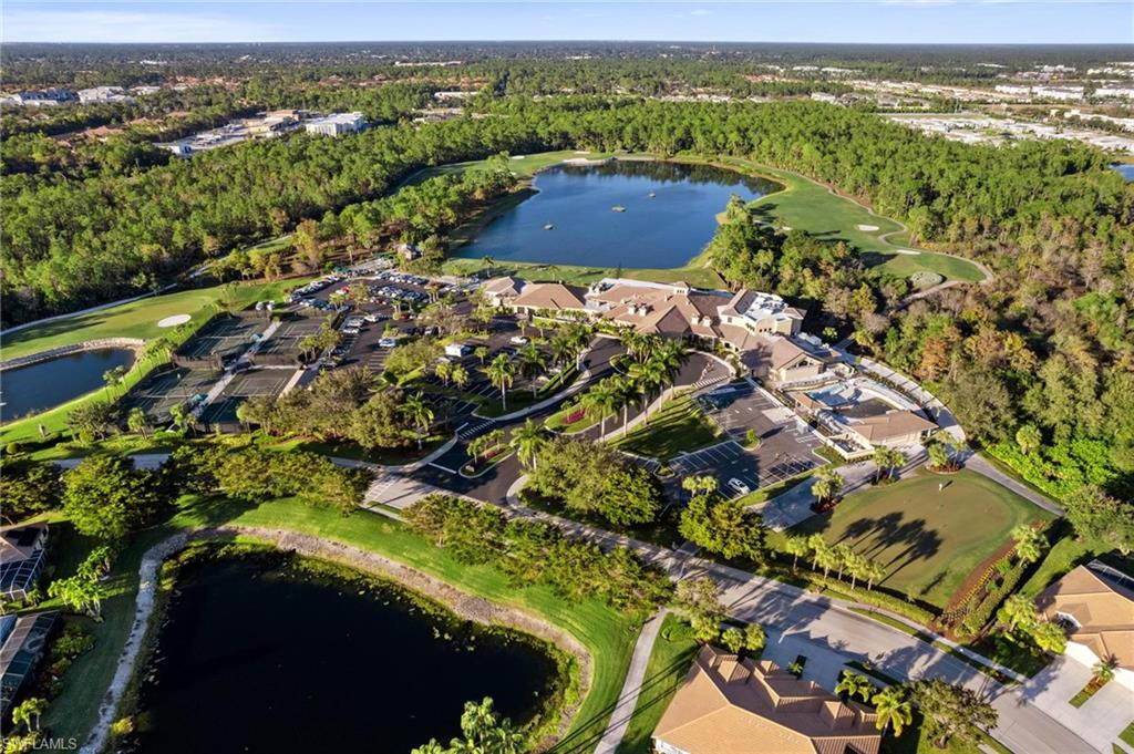 8610 Cedar Hammock Circle, Unit 1242 Naples, FL 34112 - Photo 46 of 50 an aerial view of residential houses with outdoor space