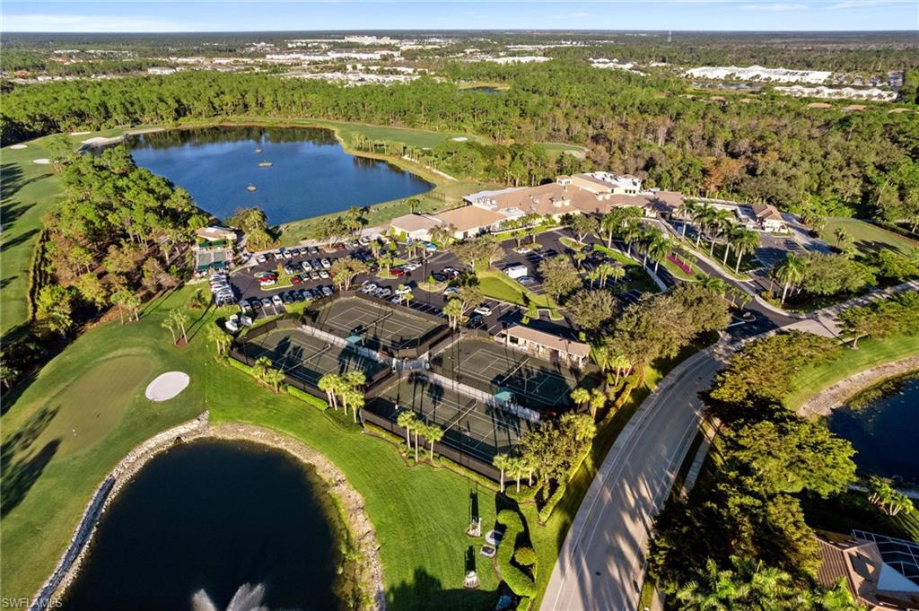 8610 Cedar Hammock Circle, Unit 1242 Naples, FL 34112 - Photo 47 of 50 an aerial view of residential houses with outdoor space