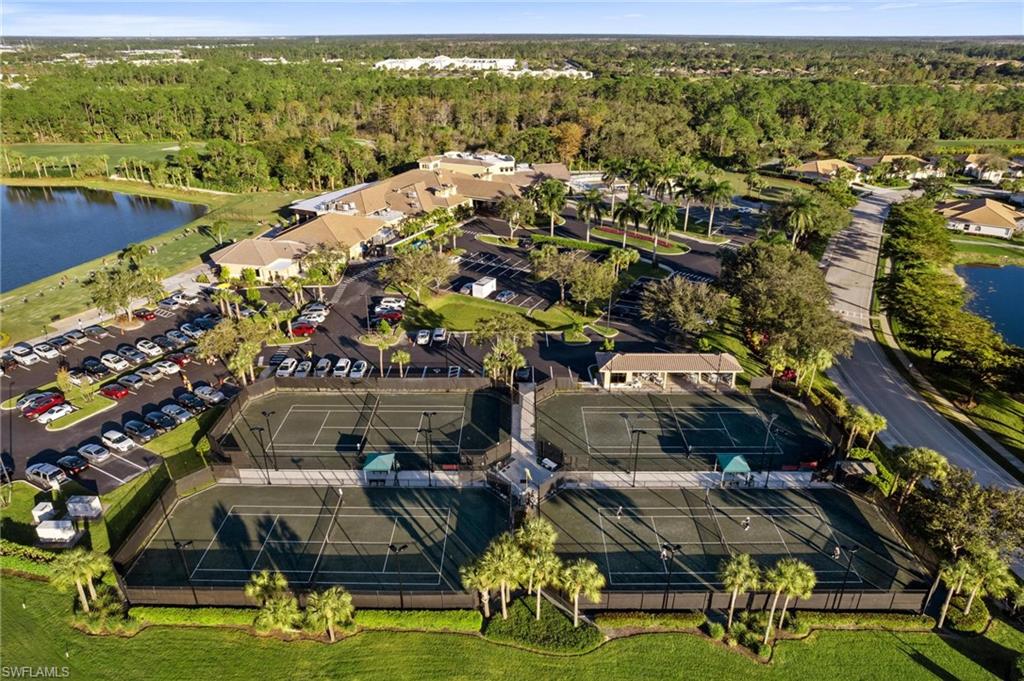 8610 Cedar Hammock Circle, Unit 1242 Naples, FL 34112 - Photo 48 of 50 a view of houses with swimming pool