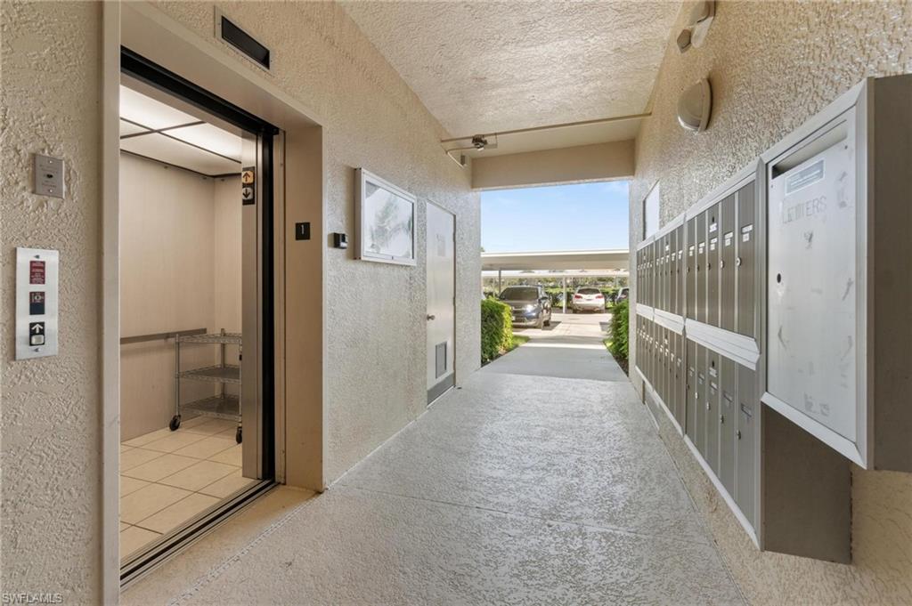 8610 Cedar Hammock Circle, Unit 1242 Naples, FL 34112 - Photo 5 of 50 a view of hallway with wooden floor