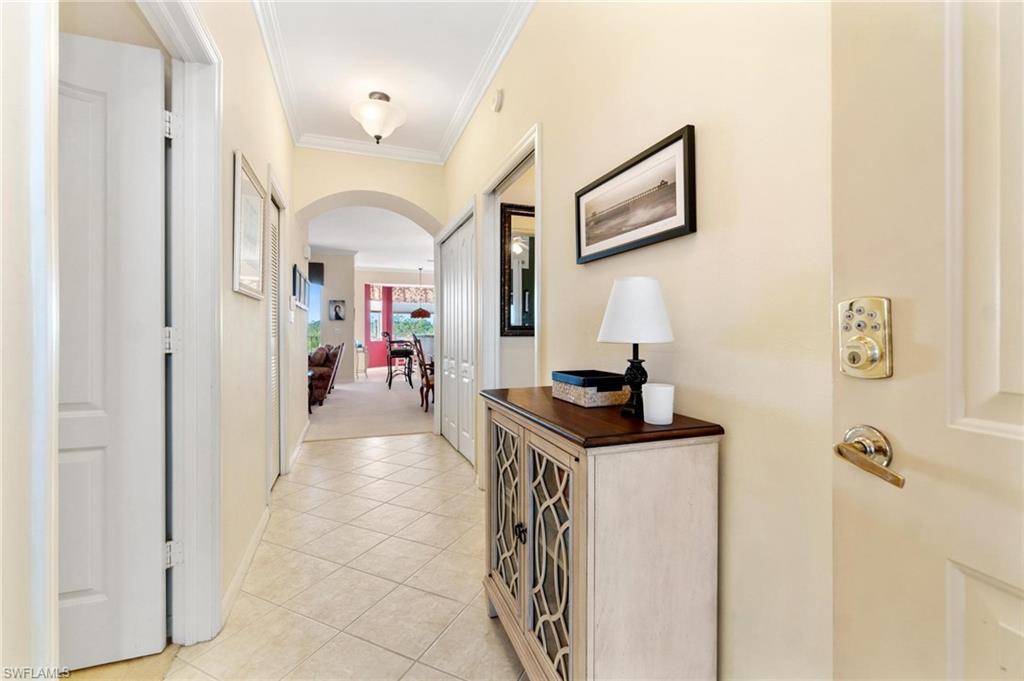 8610 Cedar Hammock Circle, Unit 1242 Naples, FL 34112 - Photo 7 of 50 a view of a hallway view with furniture