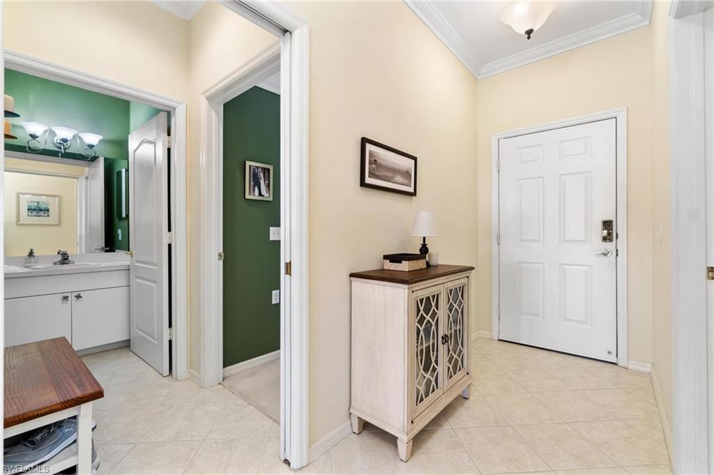 8610 Cedar Hammock Circle, Unit 1242 Naples, FL 34112 - Photo 9 of 50 a view of kitchen with sink refrigerator and natural light