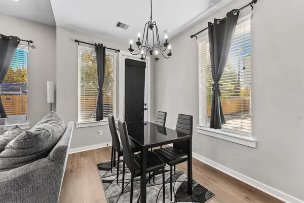 a view of a dining room with furniture window and outside view