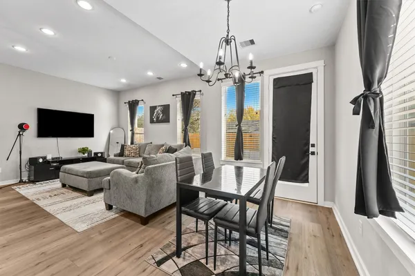 a living room with fireplace furniture and a flat screen tv