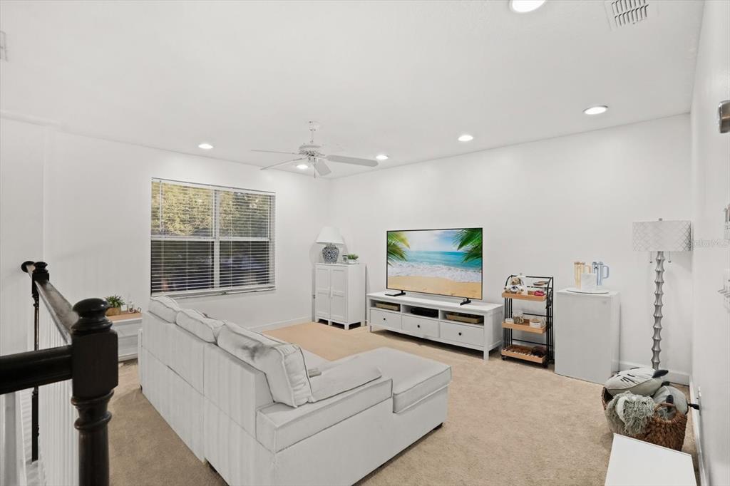 248 Longhirst Loop Ocoee, FL 34761 - Photo 14 of 30 a living room with furniture and a flat screen tv