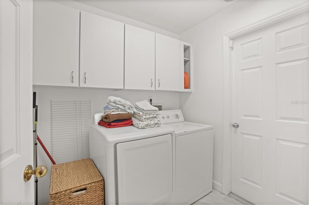 248 Longhirst Loop Ocoee, FL 34761 - Photo 17 of 30 a utility room with dryer and washer