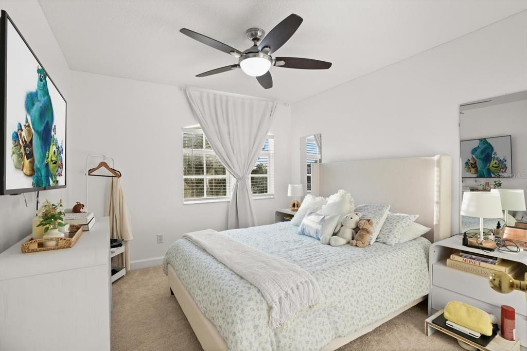 248 Longhirst Loop Ocoee, FL 34761 - Photo 21 of 30 a bedroom with a bed and a window