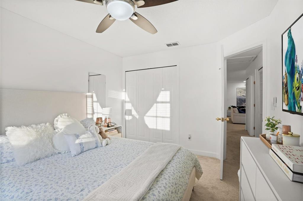 248 Longhirst Loop Ocoee, FL 34761 - Photo 22 of 30 a bedroom with a bed and window