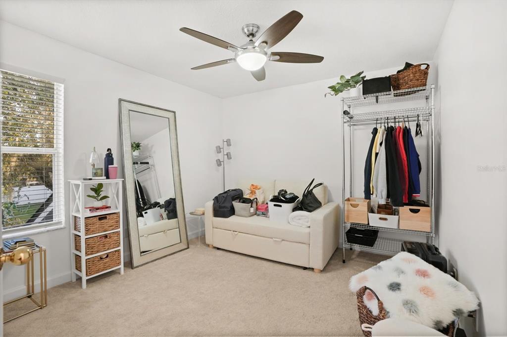 248 Longhirst Loop Ocoee, FL 34761 - Photo 23 of 30 a living room with furniture and a flat screen tv