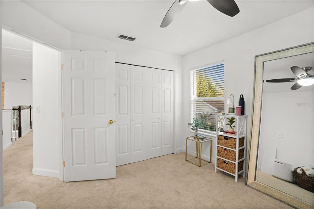 248 Longhirst Loop Ocoee, FL 34761 - Photo 24 of 30 a room with furniture and a window