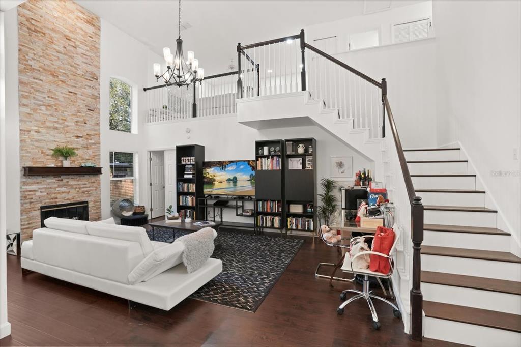 248 Longhirst Loop Ocoee, FL 34761 - Photo 5 of 30 a living room with furniture and a chandelier
