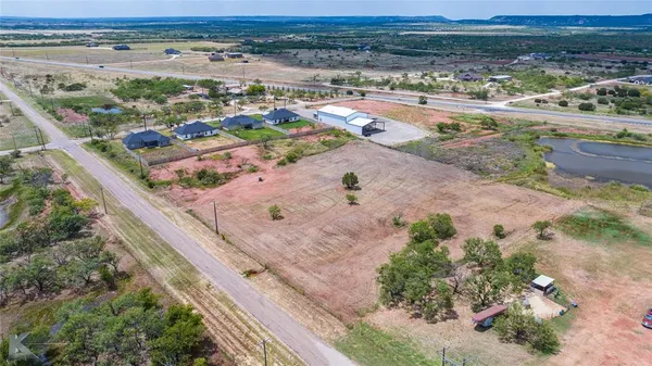 an aerial view of beach and an ocean