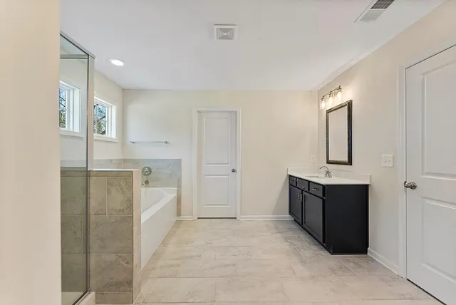a view of a kitchen cabinets and refrigerator