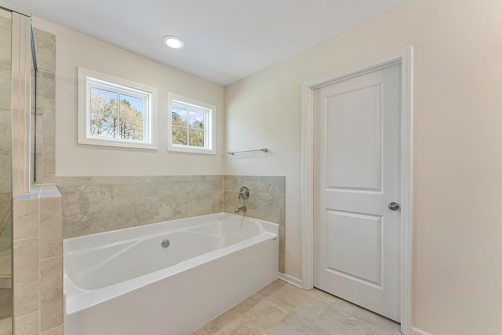 515 Bohannon Road Grantville, GA 30220 - Photo 30 of 40 a white bath tub sitting next to a window