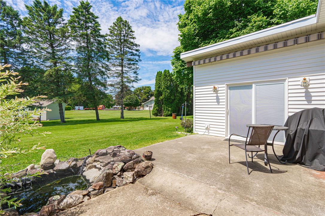 579 Cherry Road Northampton, PA 18067 - Photo 47 of 57 A spacious backyard with mature trees provides a tranquil outdoor retreat with a private patio with retractable awning and pond.