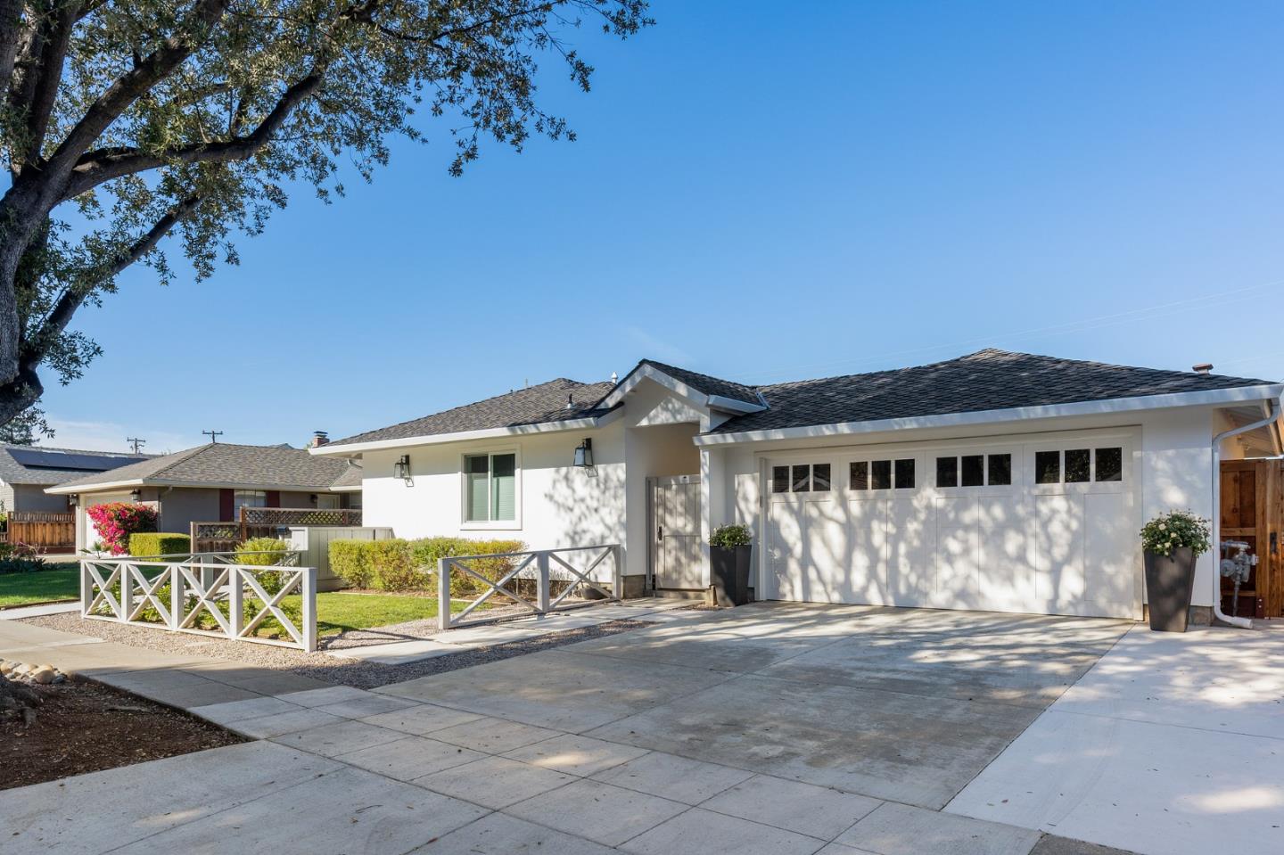1641 Hyacinth Lane San Jose, CA 95124 - Photo 1 of 31 a view of a white house with large windows and a small yard