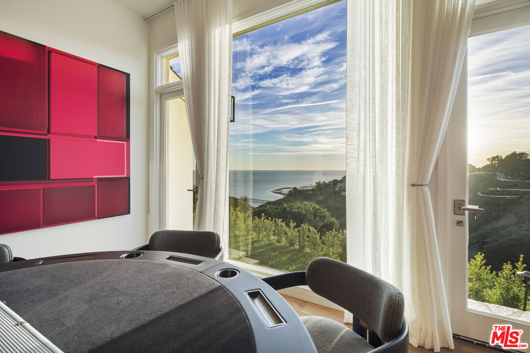 3140 Sweetwater Mesa Road Malibu, CA 90265 - Photo 28 of 71 a bedroom with a bed and a window