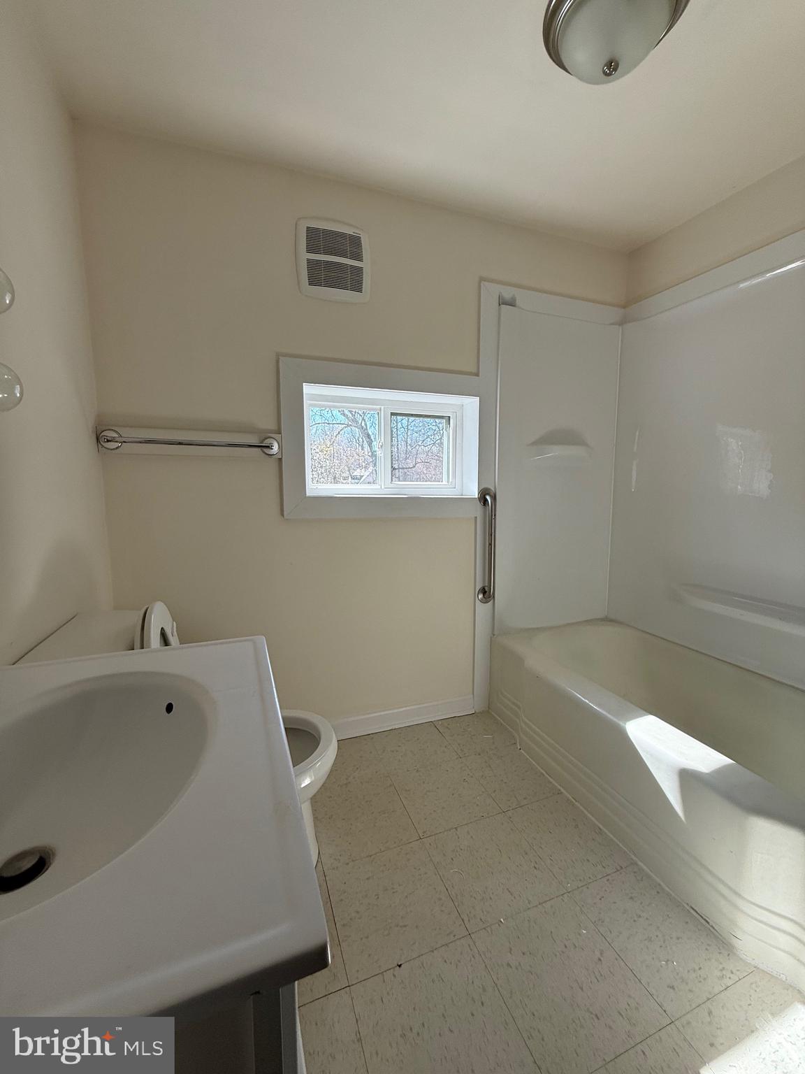 9253 Dahlgren Road King George, VA 22485 - Photo 11 of 23 a bathroom with a tub a sink and a shower
