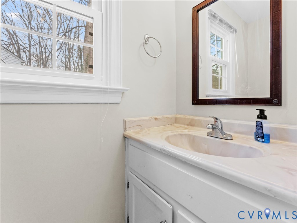 5813 Bent Creek Road Midlothian, VA 23112 - Photo 14 of 50 a bathroom with a sink and a mirror