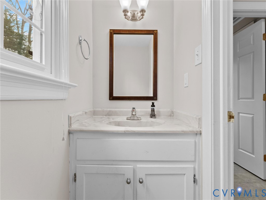 5813 Bent Creek Road Midlothian, VA 23112 - Photo 15 of 50 a bathroom with a sink and a mirror