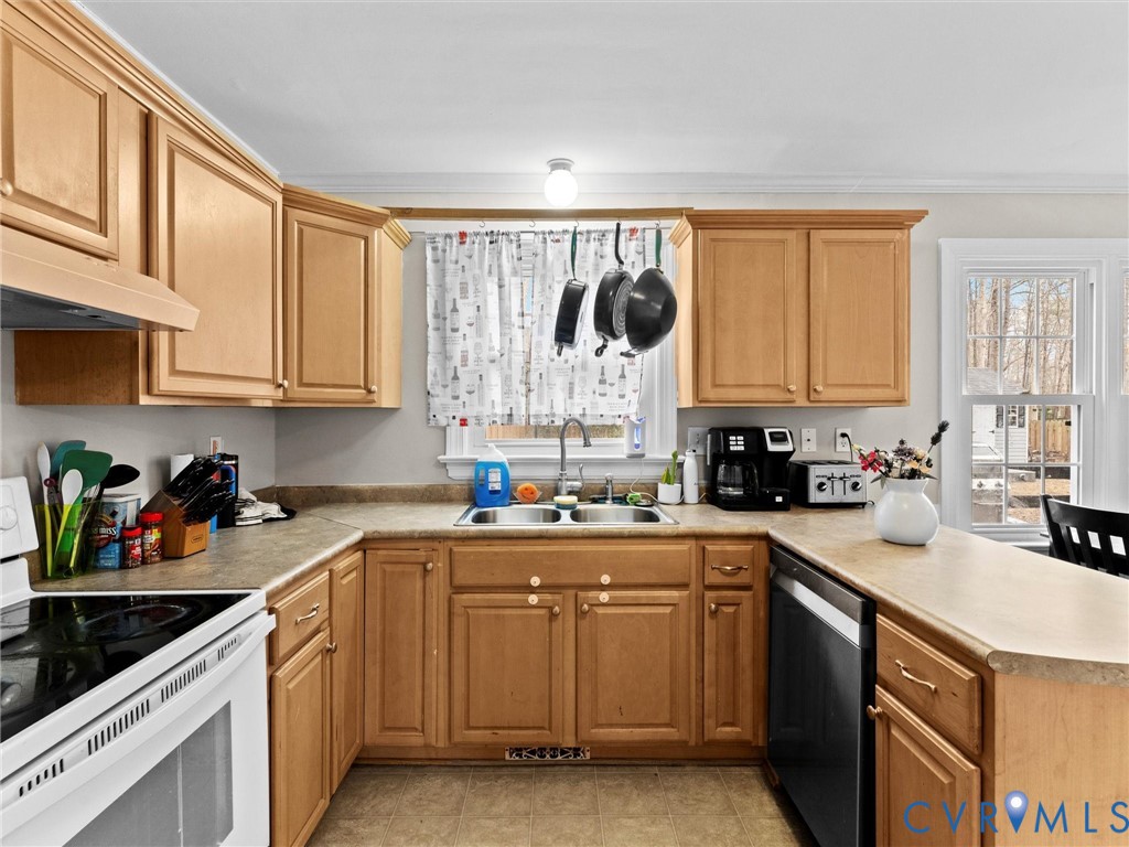 5813 Bent Creek Road Midlothian, VA 23112 - Photo 18 of 50 a kitchen with a sink stove top oven and cabinets