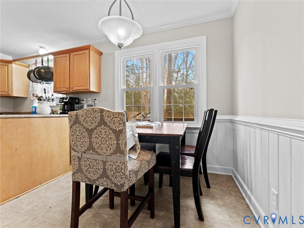 5813 Bent Creek Road Midlothian, VA 23112 - Photo 23 of 50 a view of a dining room with furniture and a window
