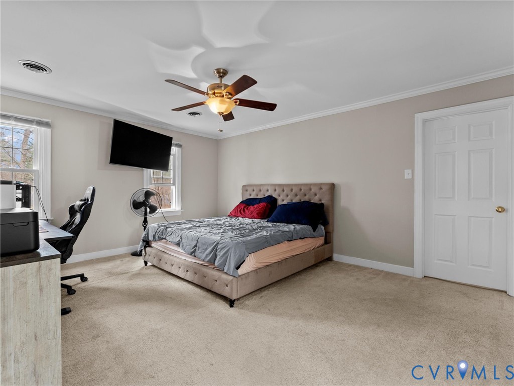 5813 Bent Creek Road Midlothian, VA 23112 - Photo 28 of 50 a bedroom with a bed and a flat screen tv