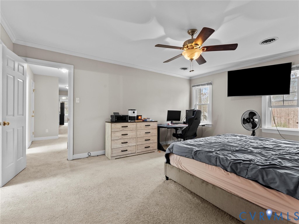 5813 Bent Creek Road Midlothian, VA 23112 - Photo 29 of 50 a bedroom with a bed and a flat screen tv