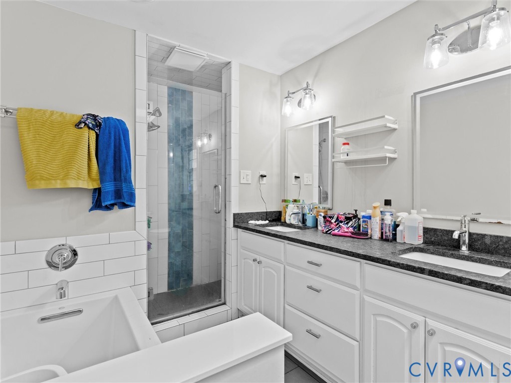 5813 Bent Creek Road Midlothian, VA 23112 - Photo 31 of 50 a bathroom with a double vanity sink mirror and shower