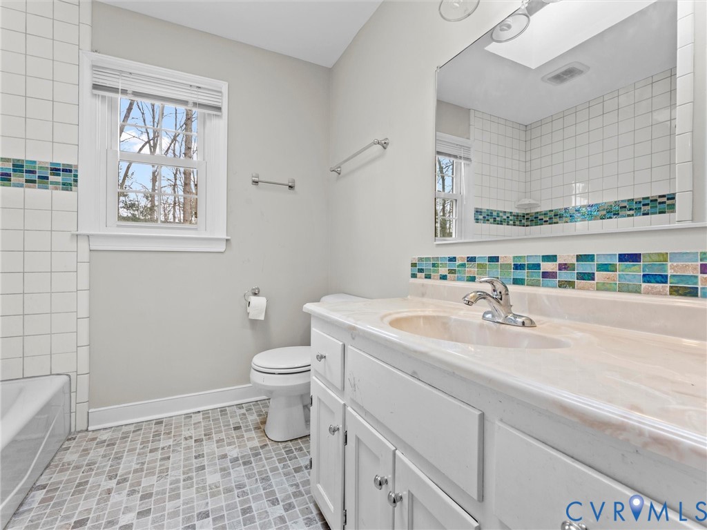 5813 Bent Creek Road Midlothian, VA 23112 - Photo 33 of 50 a bathroom with a sink a toilet and mirror