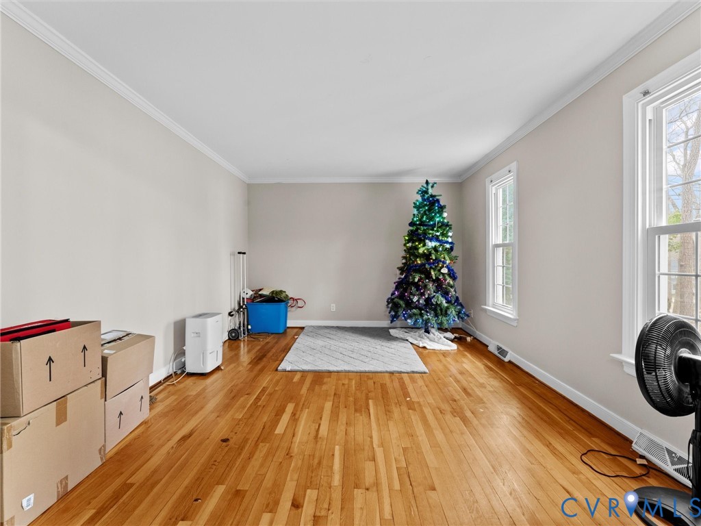 5813 Bent Creek Road Midlothian, VA 23112 - Photo 5 of 50 a room with wooden floor and window