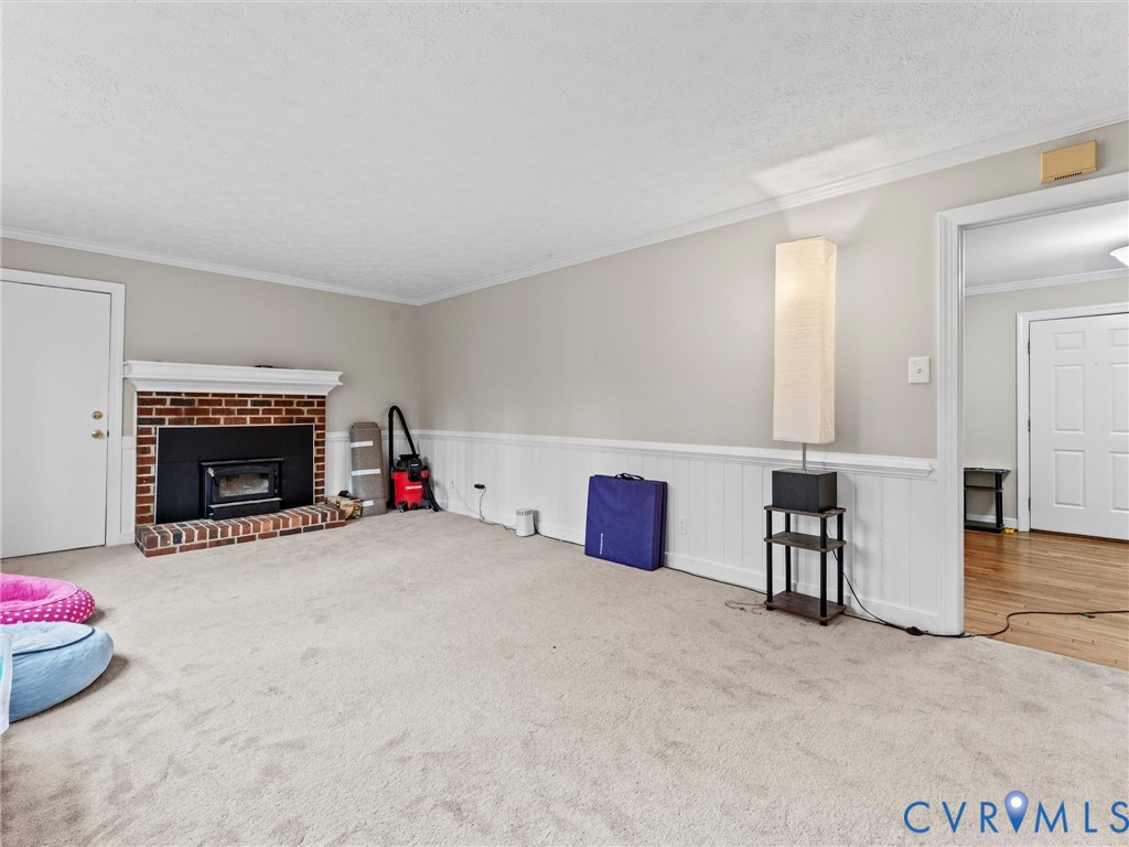 5813 Bent Creek Road Midlothian, VA 23112 - Photo 10 of 50 a living room with furniture and a fireplace