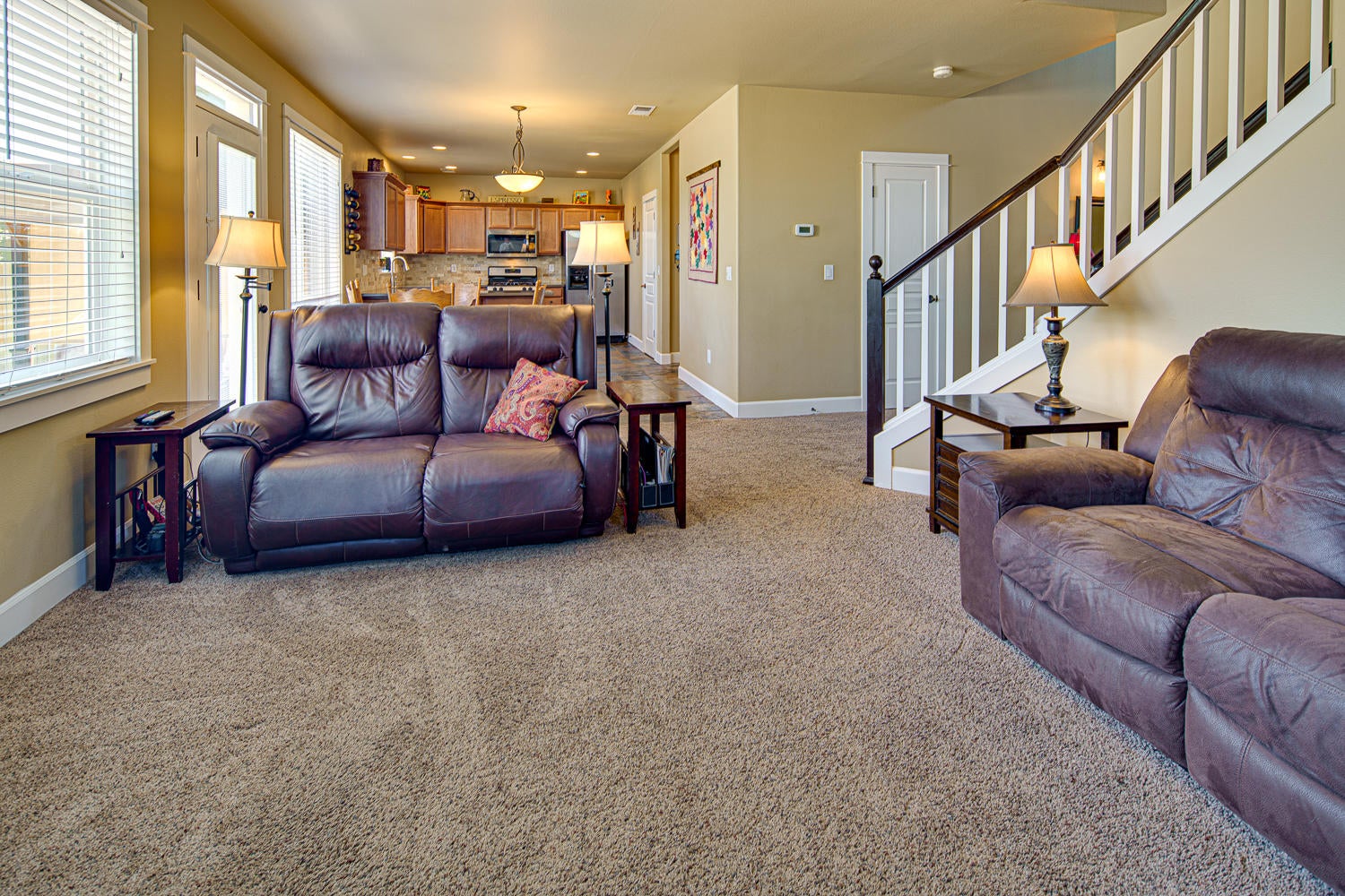 1364 Southwest Rimrock Way Redmond, OR 97756 - Photo 9 of 38 Great room easily fits an oversize sofa and love seat, with a wall of windows opening to the fully landscapd back yard and Dry Canyon.