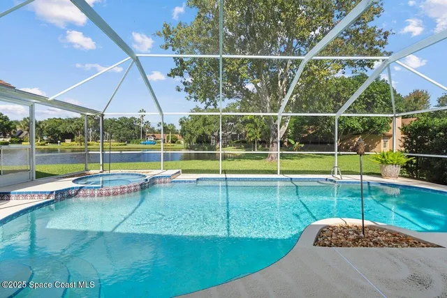 a view of a backyard with swimming pool