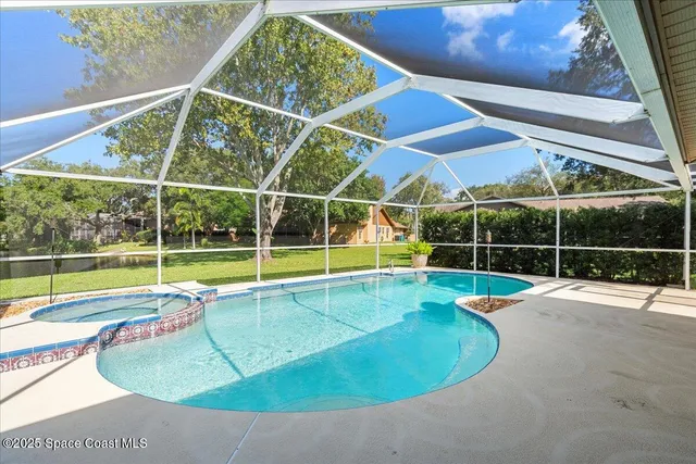 a view of a backyard with a swimming pool