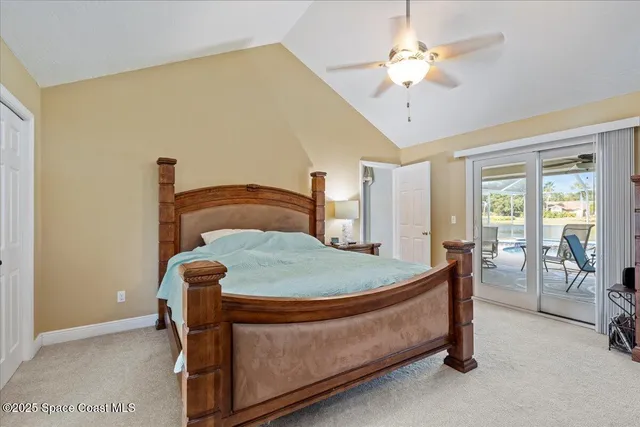 a bed sitting in a room next to a window