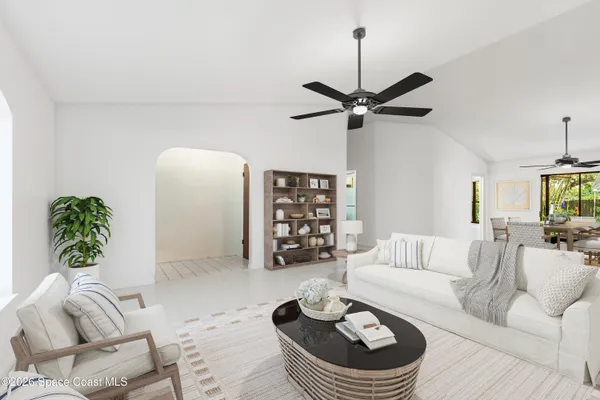 a living room with furniture and a window