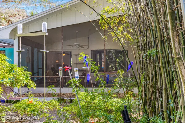 a living room with furniture a rug and a window