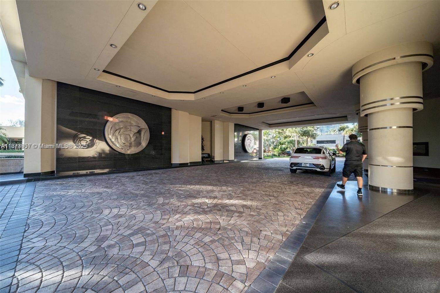 20191 East Country Club Drive, Unit 1903 Aventura, FL 33180 - Photo 19 of 19 a view of a livingroom with furniture and a window