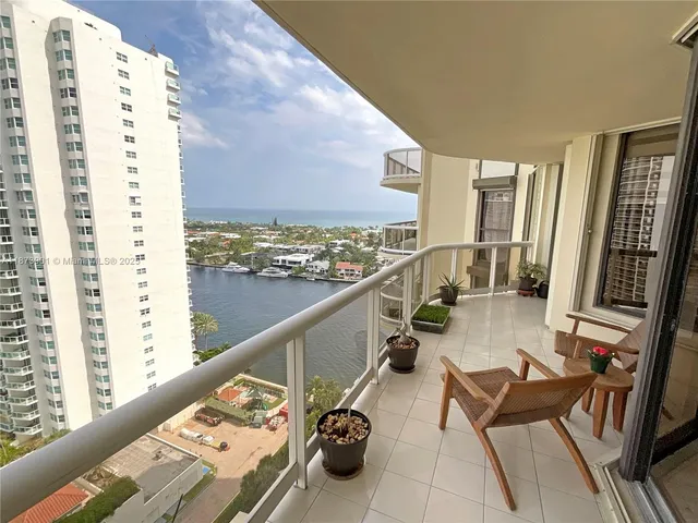 a view of balcony with furniture
