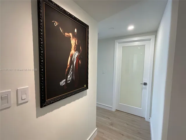 a view of gallery with wooden floor