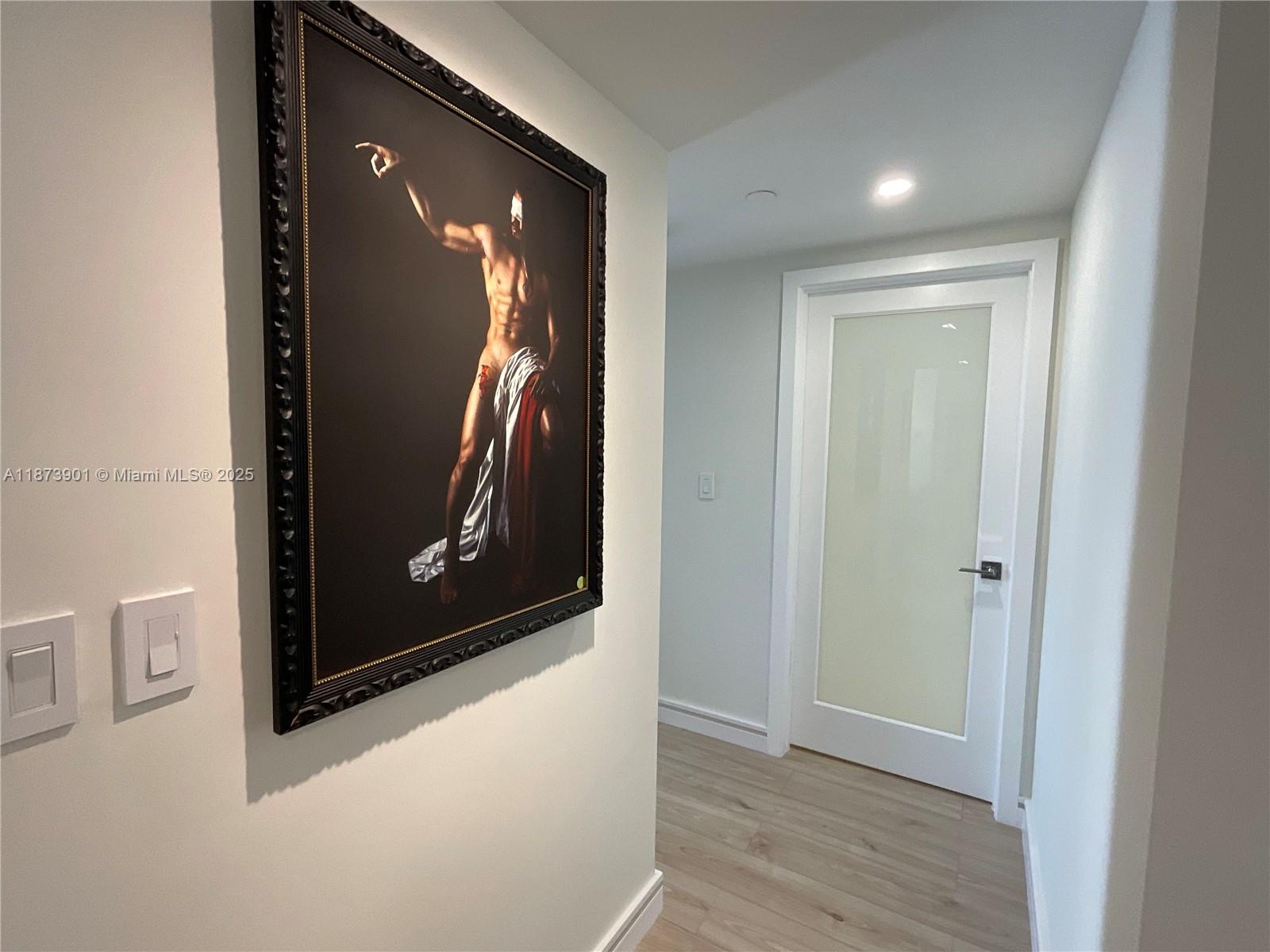 20191 East Country Club Drive, Unit 1903 Aventura, FL 33180 - Photo 7 of 19 a view of gallery with wooden floor