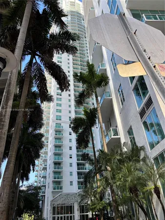 an aerial view of a residential apartment building with a yard