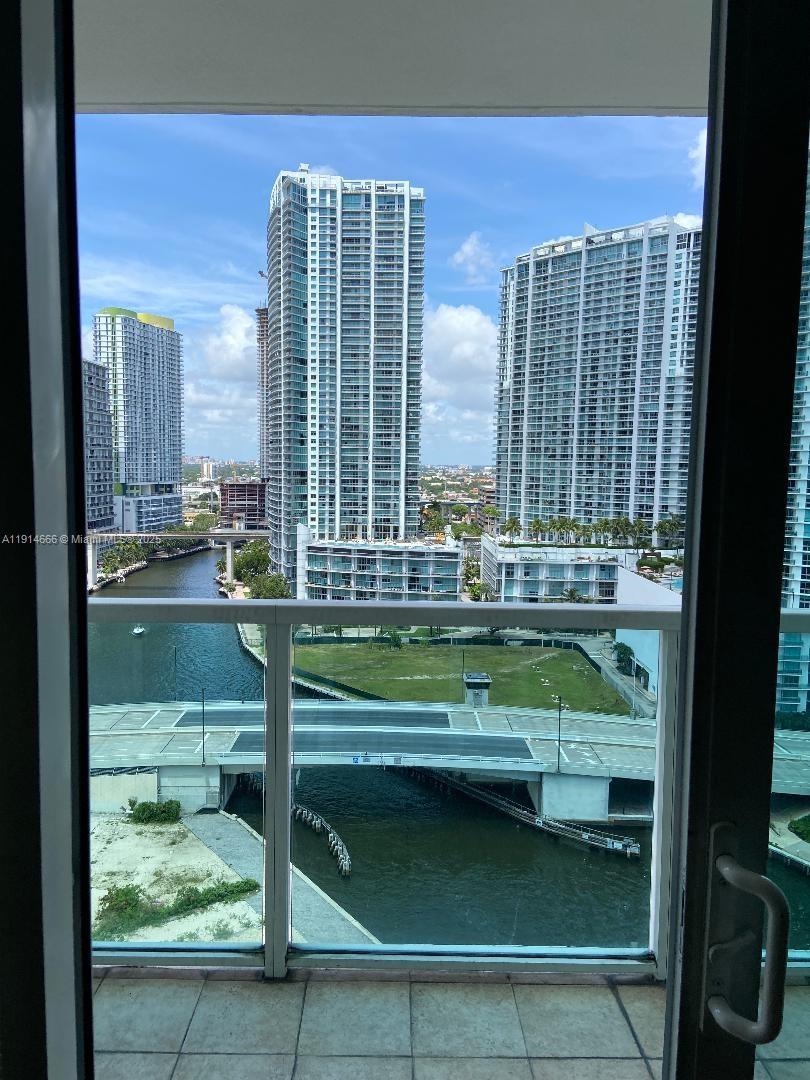 31 Southeast 5th Street, Unit 2103 Miami, FL 33131 - Photo 6 of 17 a view of pool with outdoor seating and a yard