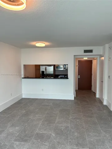 a view of hallway with kitchen
