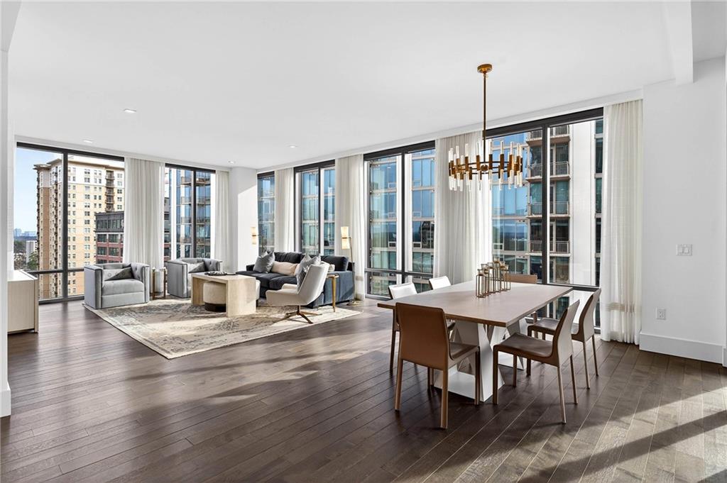 a view of a dining room with furniture window and wooden floor