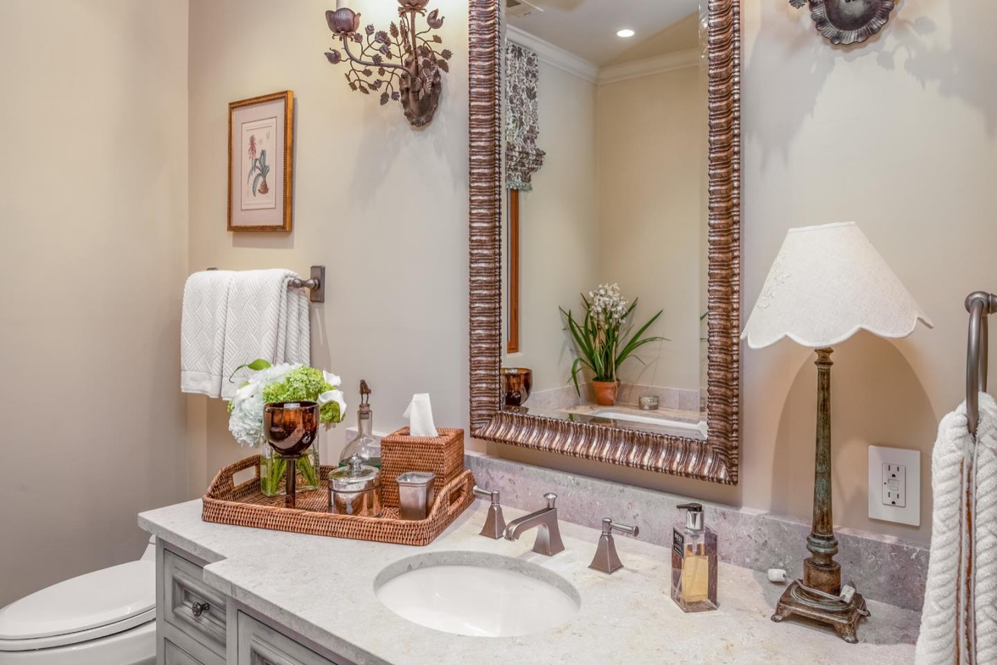 6 Vista Cielo Carmel, CA 93923 - Photo 23 of 50 a bathroom with a granite countertop sink a toilet and a mirror