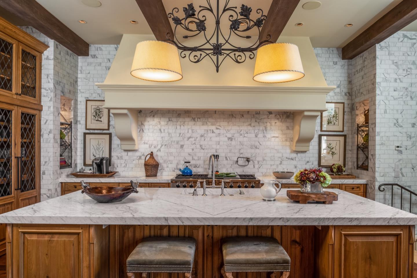 6 Vista Cielo Carmel, CA 93923 - Photo 10 of 50 a kitchen with kitchen island granite countertop a sink a stove and a wooden cabinets