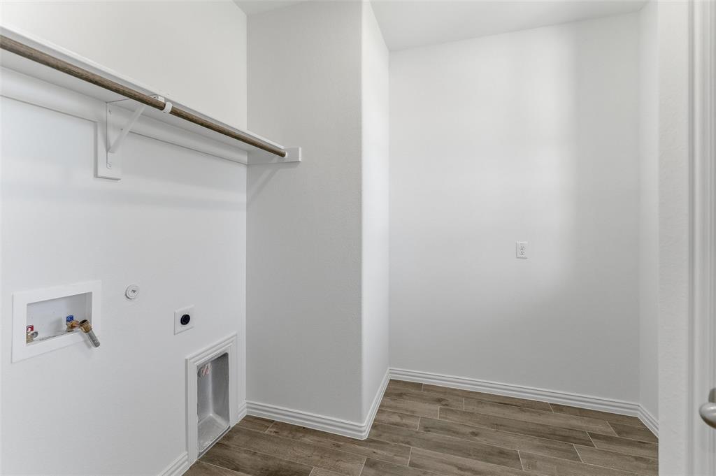 130 Fossil Canyon Drive Rhome, TX 76078 - Photo 12 of 25 Dedicated laundry area featuring modern wood-look tile flooring