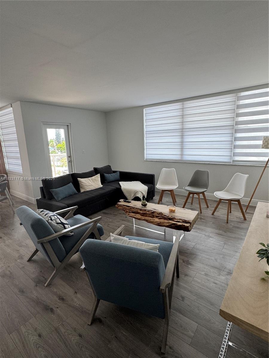 Buckley Towers Miami, FL 33179 - Photo 9 of 18 a living room with furniture and wooden floor